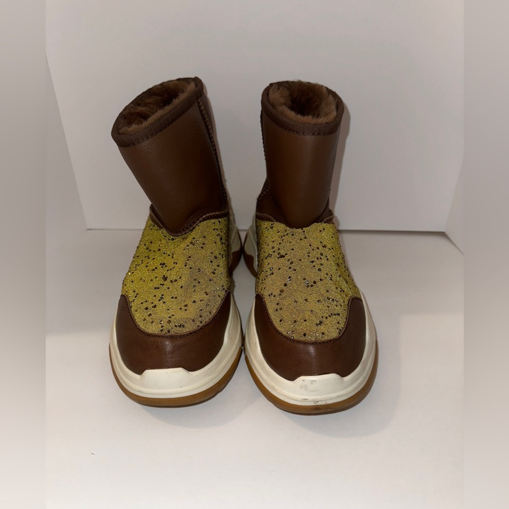 Luxe brand like new, embellished with gold like confetti. Fit more like 10.5.